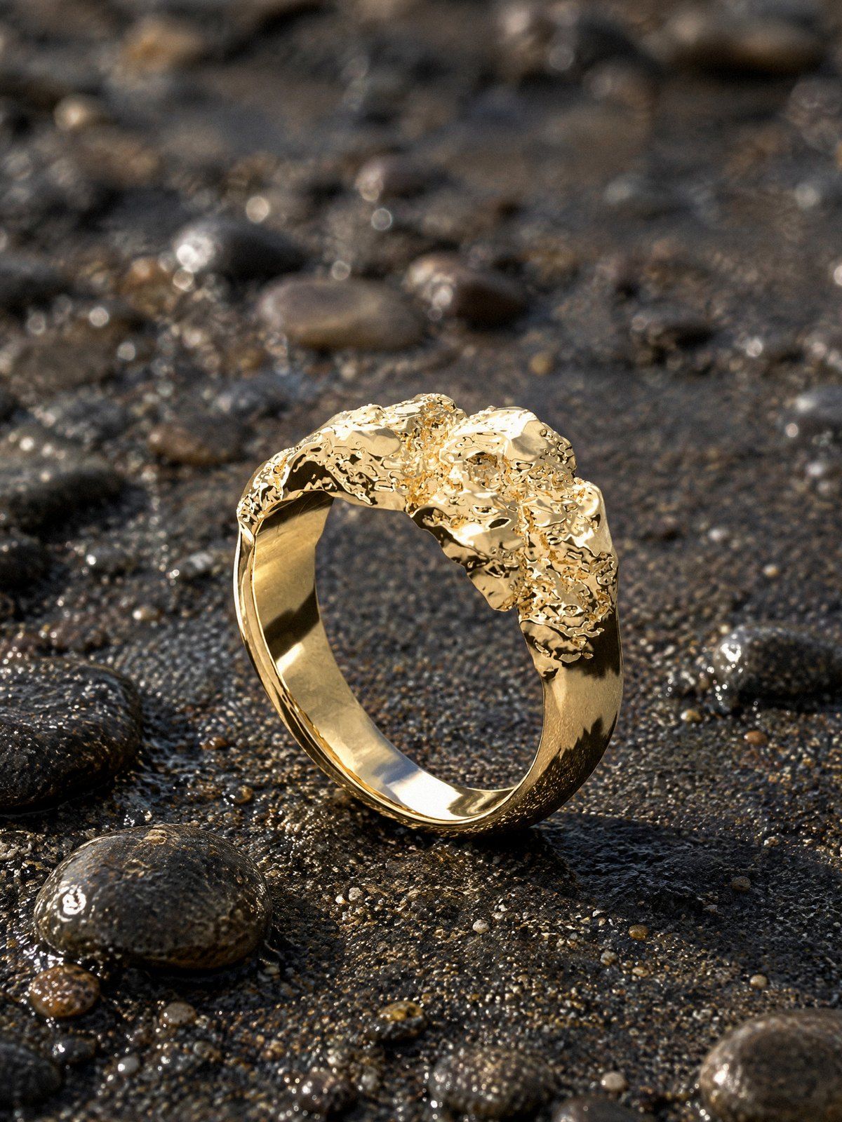 Low & Wide No. 001 in solid 14K gold, still life on river stones