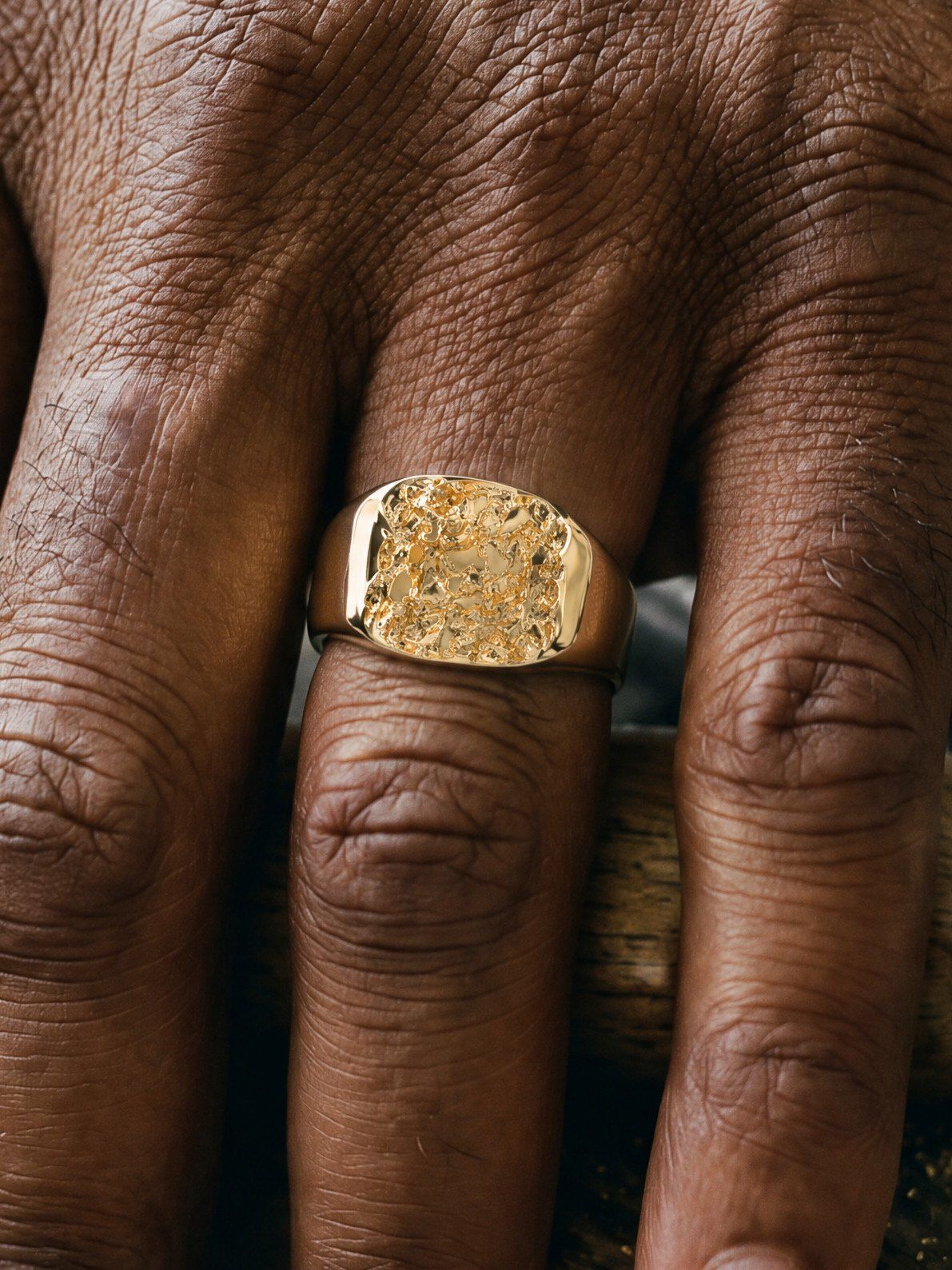 The Block No. 014 in solid 14K gold, worn, close-up on the hand