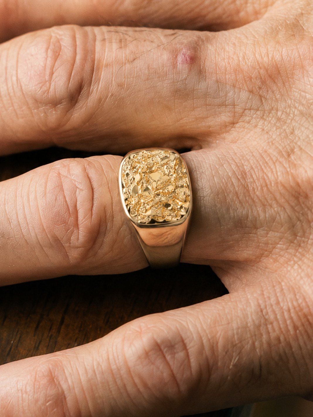 The Block No. 014 in solid 14K gold, worn on another hand
