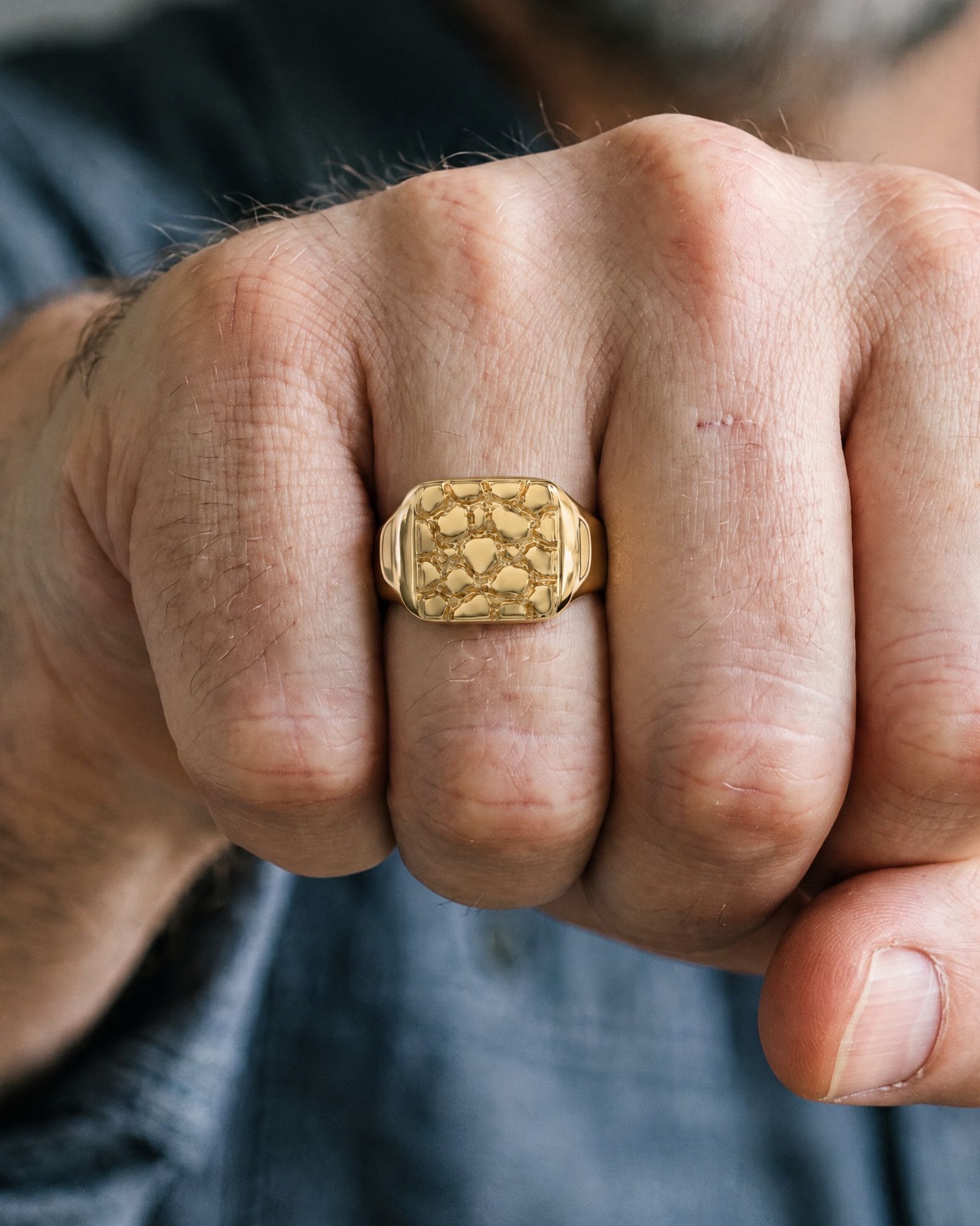 No. 401 Signet L nugget ring, worn, close-up on the hand, 14K yellow gold