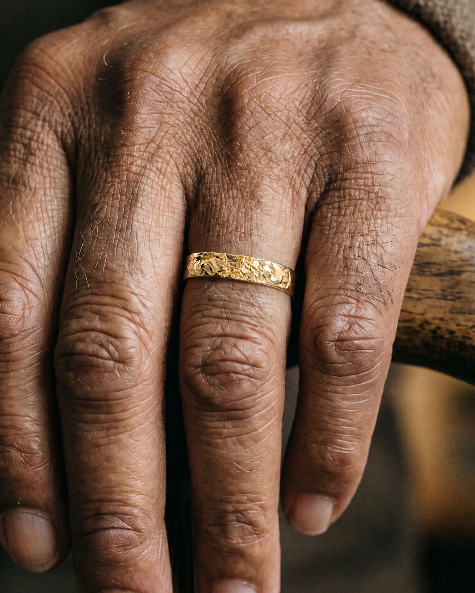 No. 024 Slim nugget ring, worn, close-up on the hand, 14K yellow gold