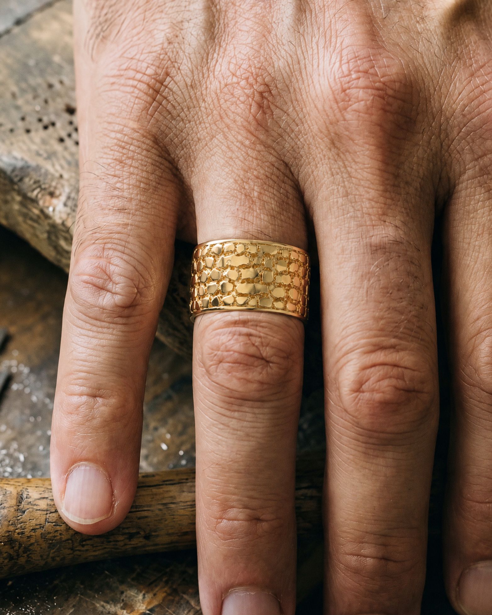 No. 447 Cigar Band nugget ring, worn, close-up on the hand, 14K yellow gold