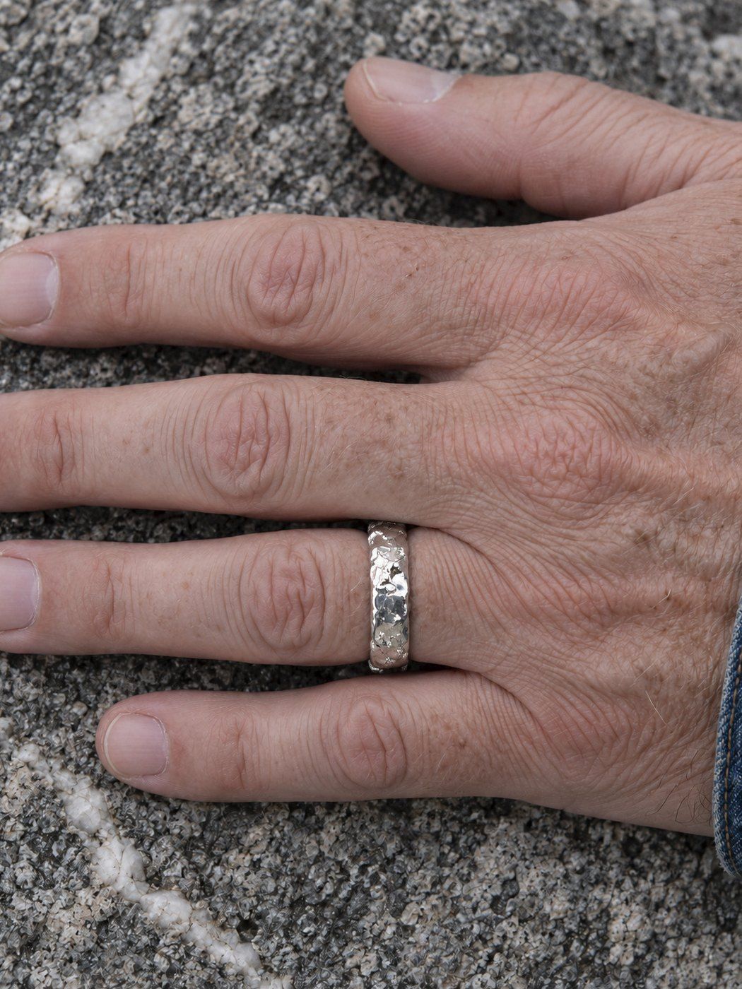 Slim No. 024 in sterling silver, worn, close-up on the hand