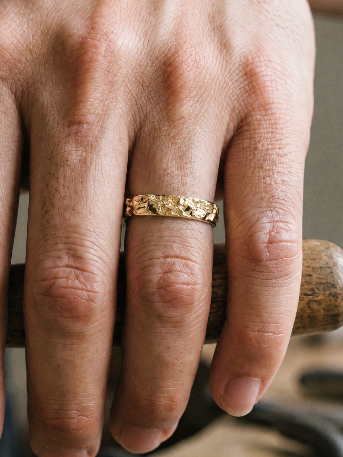Slim No. 024 in solid 14K gold, worn on another hand