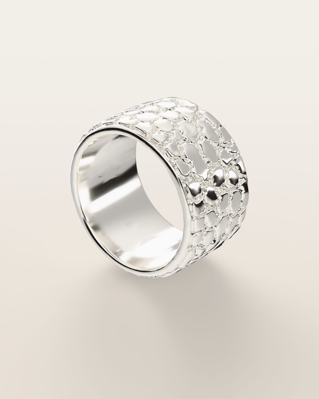 No. 447 Cigar Band nugget ring, turning slowly under a low light, sterling silver, rendered from the production 3D file