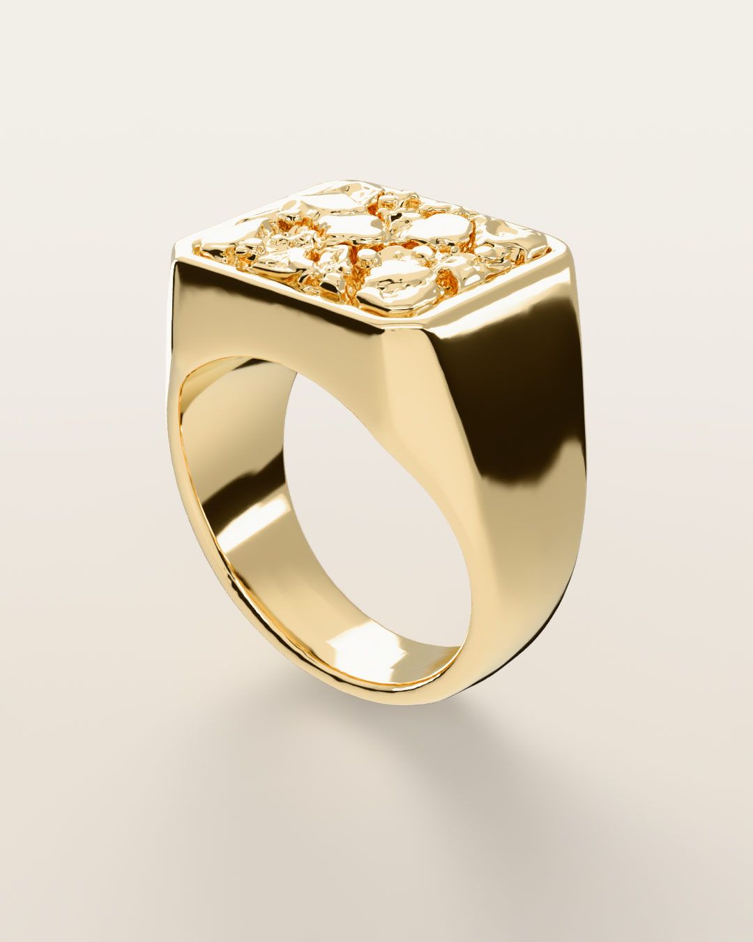 No. 501 Anvil nugget ring, turning slowly under a low light, 14K yellow gold, rendered from the production 3D file