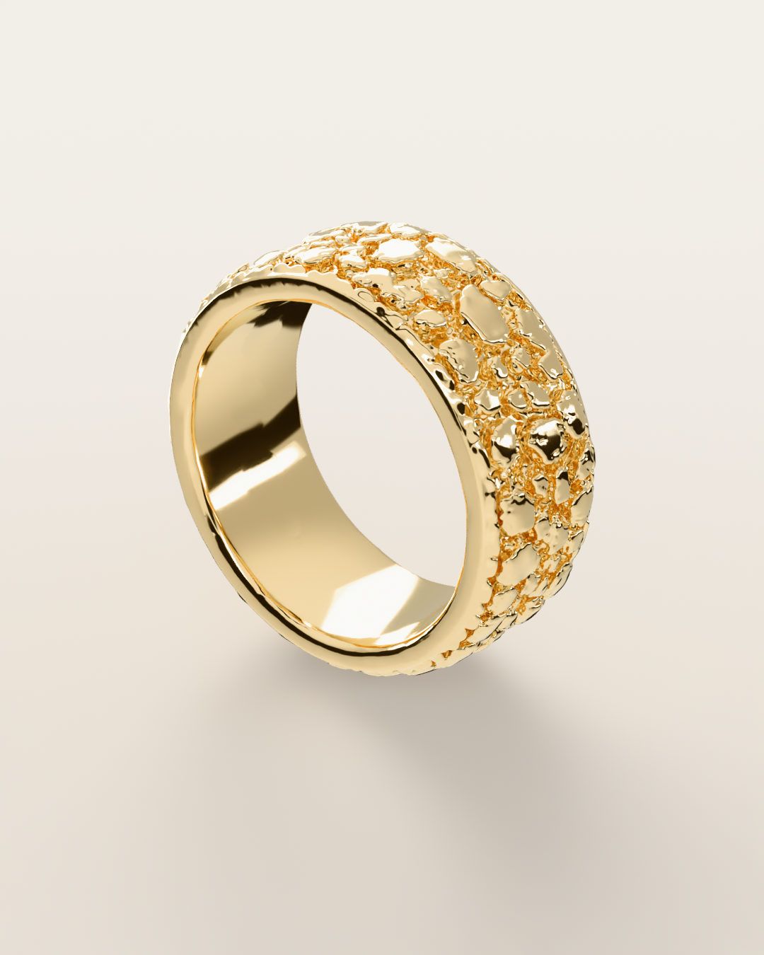 No. 508 Placer nugget ring, turning slowly under a low light, 14K yellow gold, rendered from the production 3D file