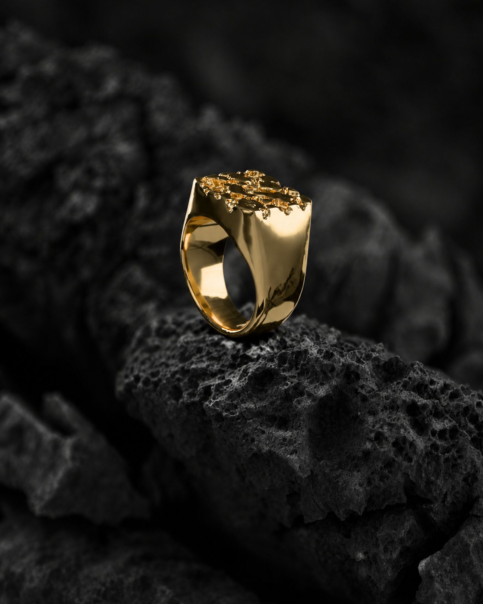 No. 502 Bullion nugget ring, still life on dark rock, 14K yellow gold
