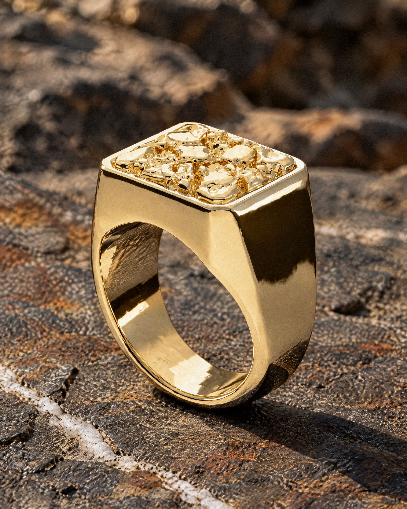 No. 501 Anvil nugget ring, still life on dark rock, 14K yellow gold