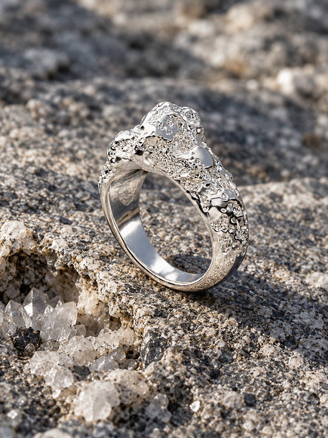 Off-Center No. 063 in sterling silver, still life on rock