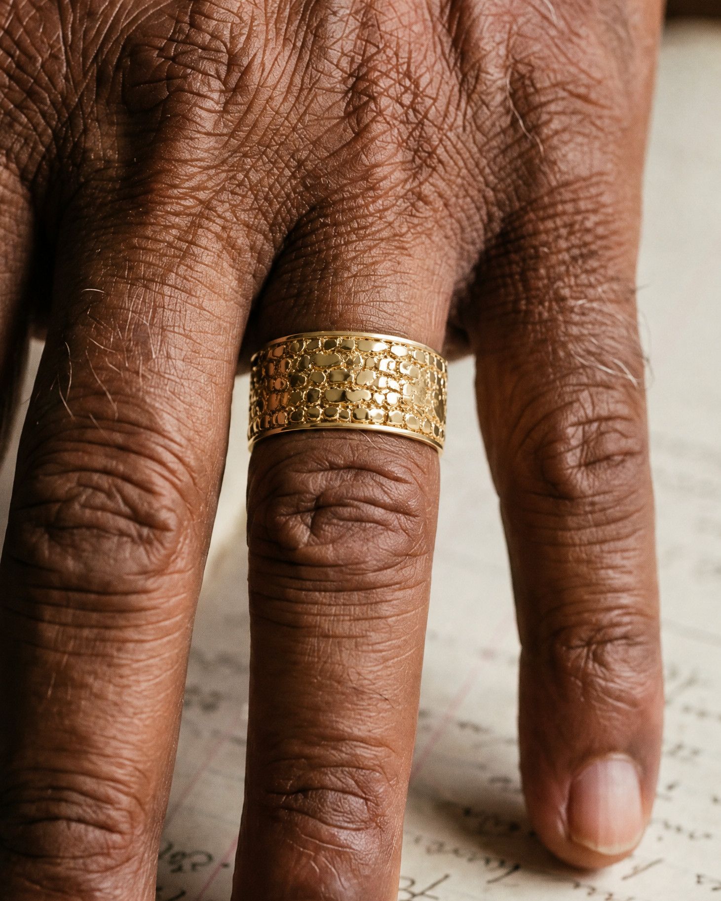No. 447 Cigar Band nugget ring, worn on the hand, 14K yellow gold