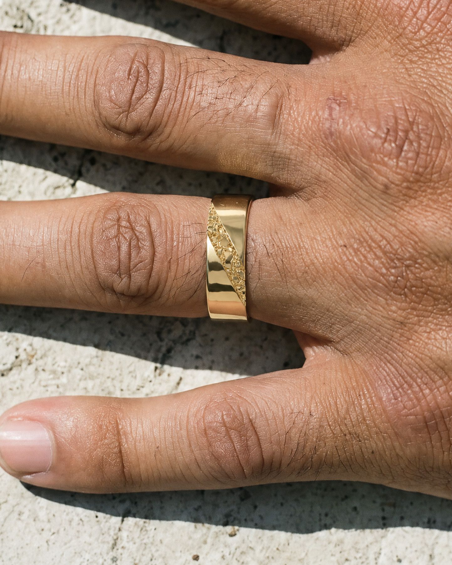 No. 518 Fault Line nugget ring, worn on the hand, 14K yellow gold
