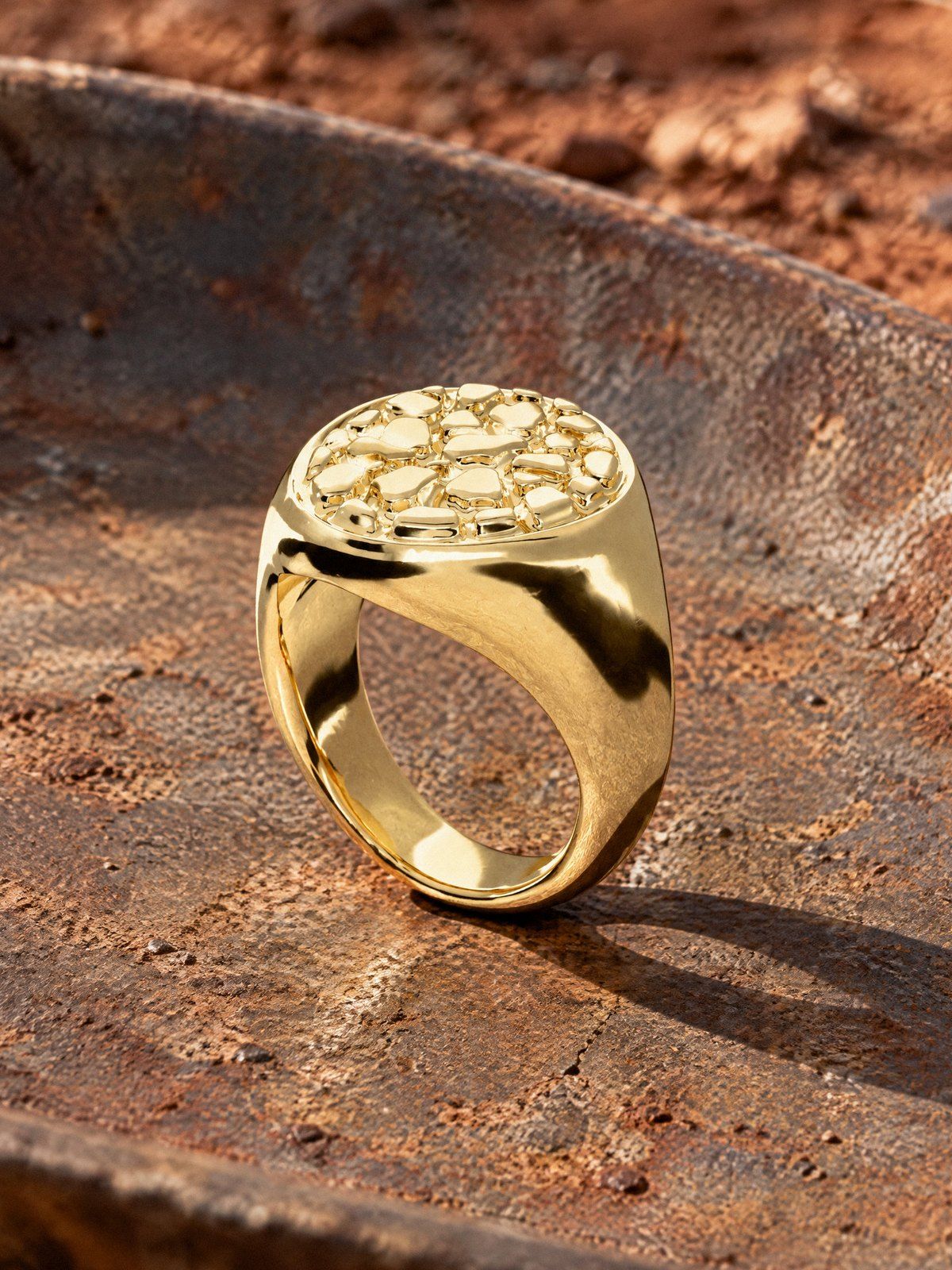 Oval No. 404 in solid 14K gold, still life on weathered stone and wood