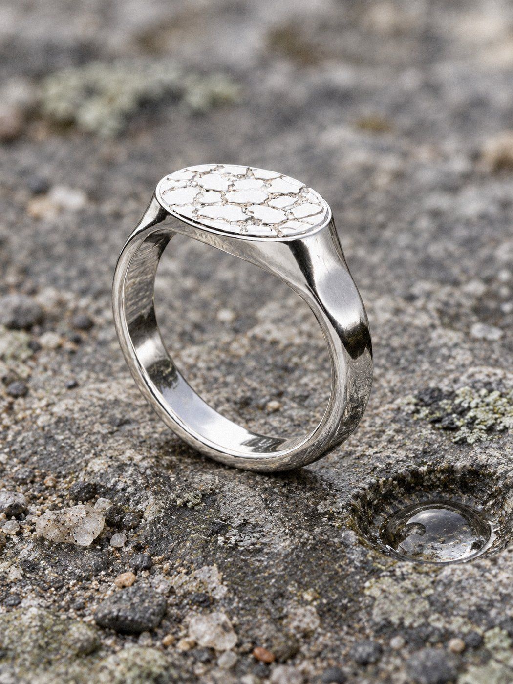 Oval No. 435 in sterling silver, still life on weathered stone and wood