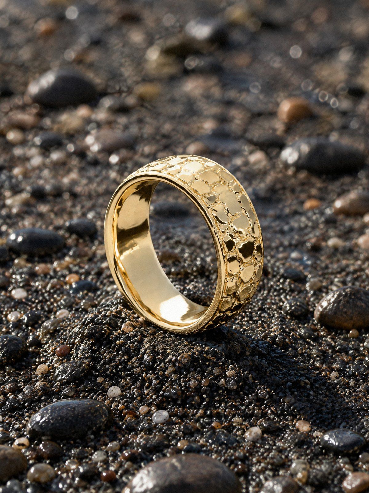 Nugget Band 8 mm No. 442 in solid 14K gold, still life on river stones