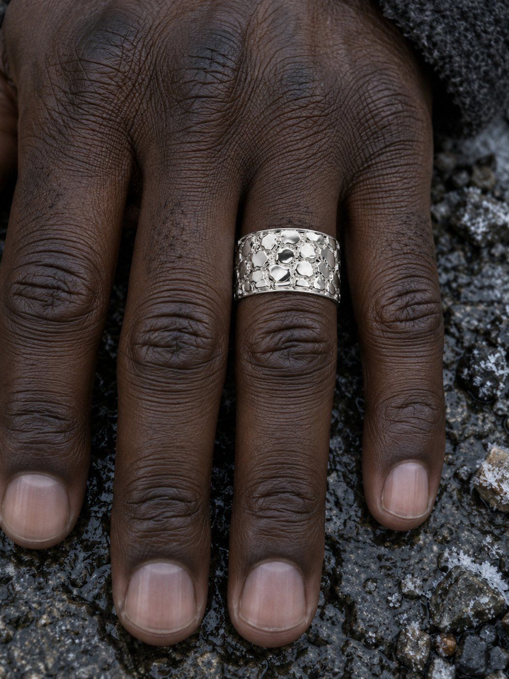 Cigar Band No. 447 in sterling silver, worn, close-up on the hand