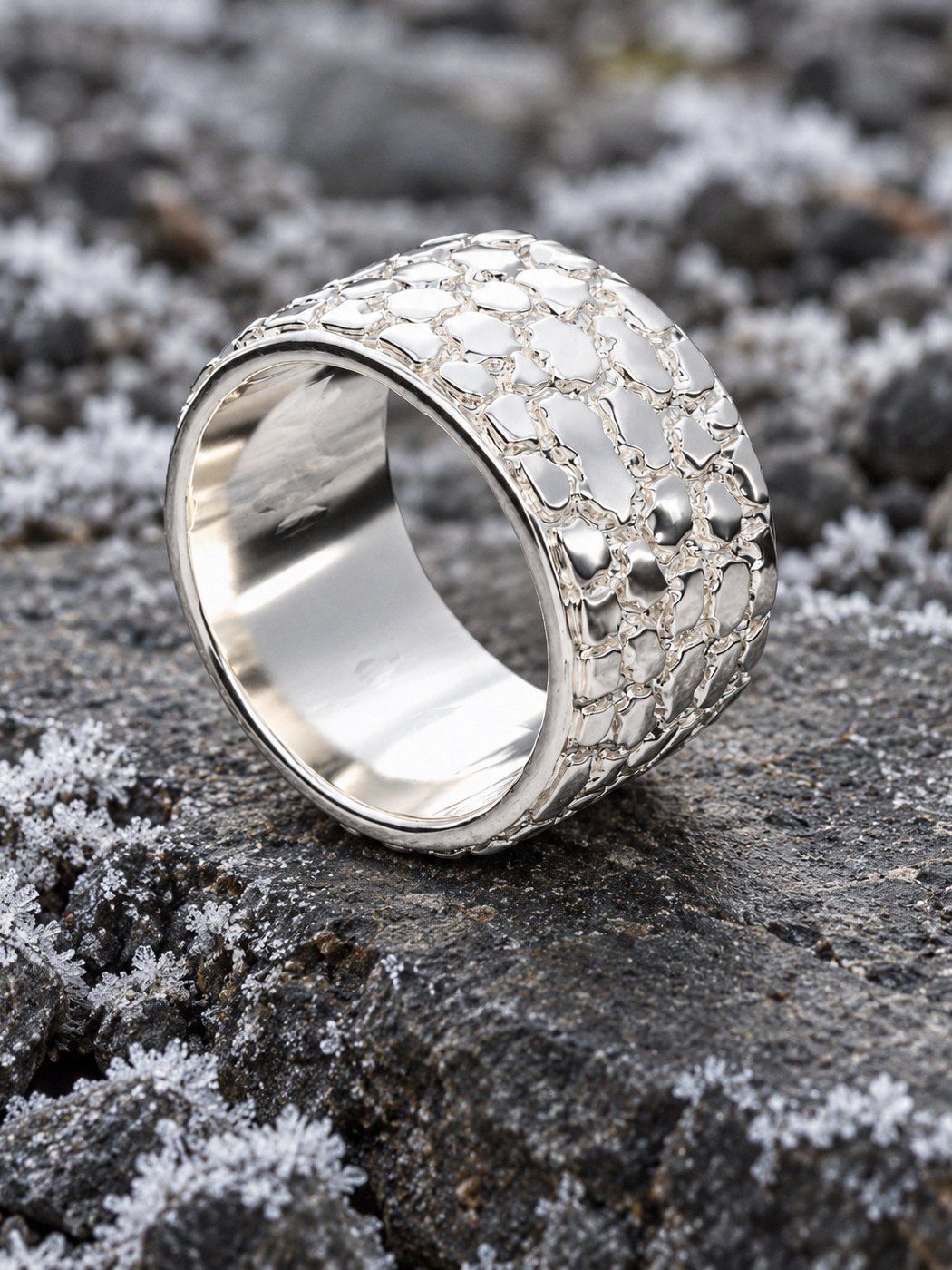 Cigar Band No. 447 in sterling silver, still life on river stones