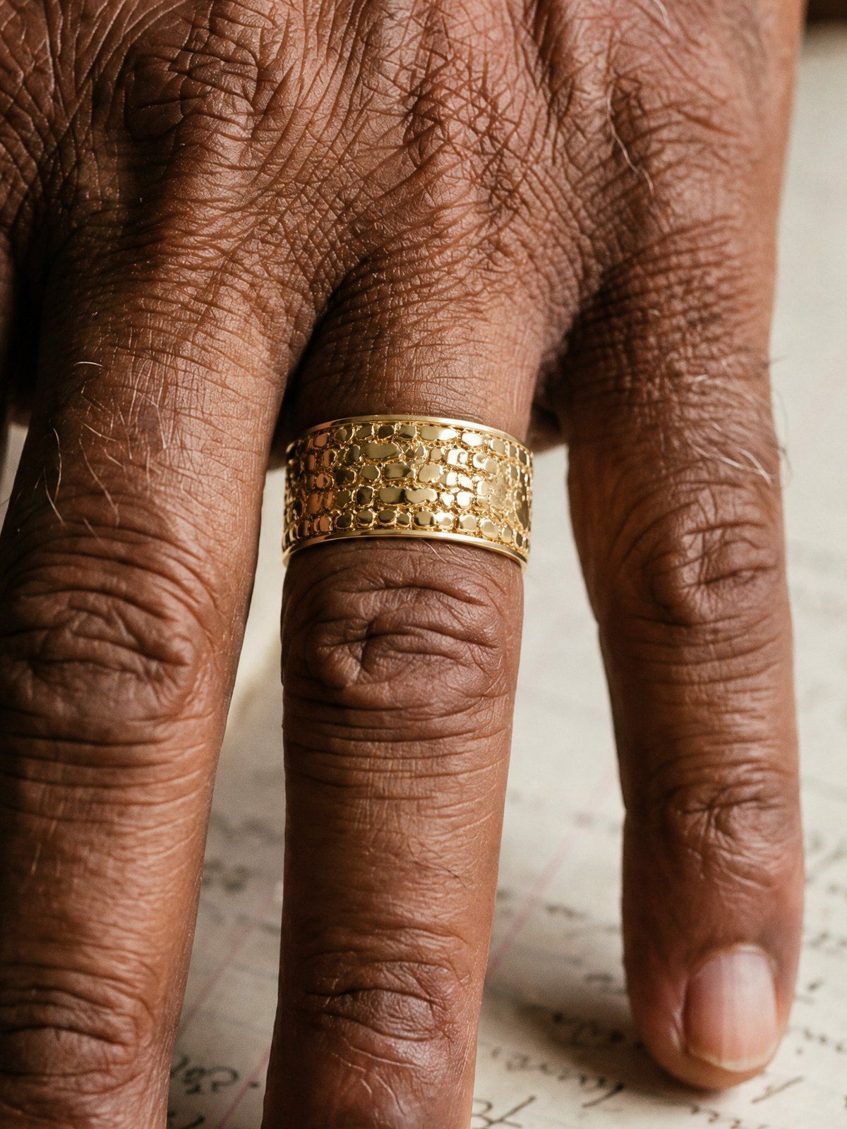 Cigar Band No. 447 in solid 14K gold, worn on the hand