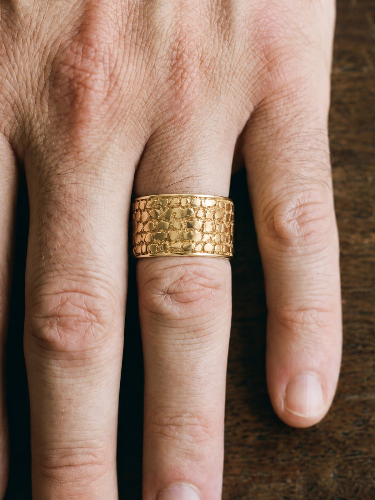 Cigar Band No. 447 in solid 14K gold, worn on another hand