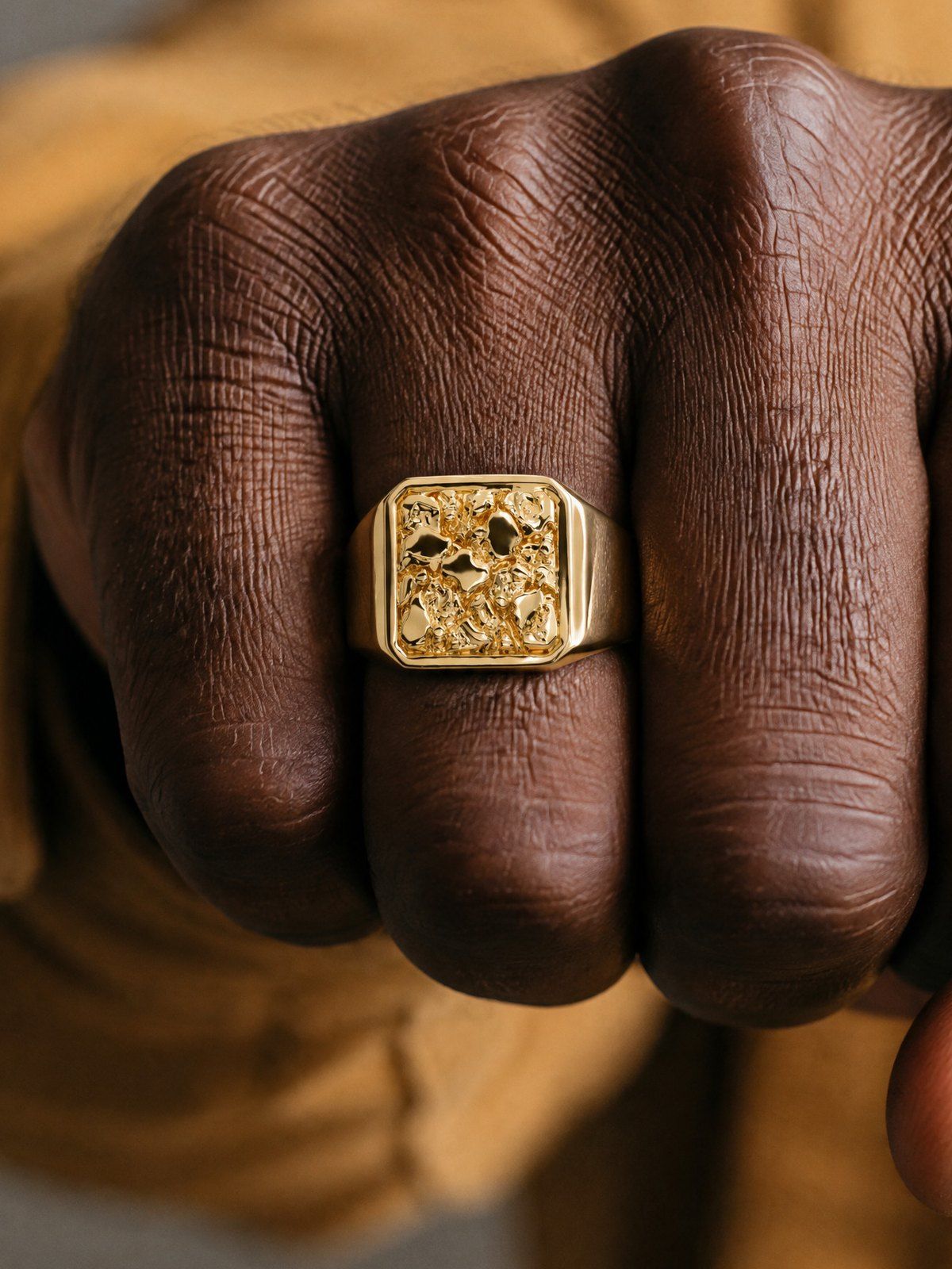 Anvil No. 501 in solid 14K gold, worn on the hand
