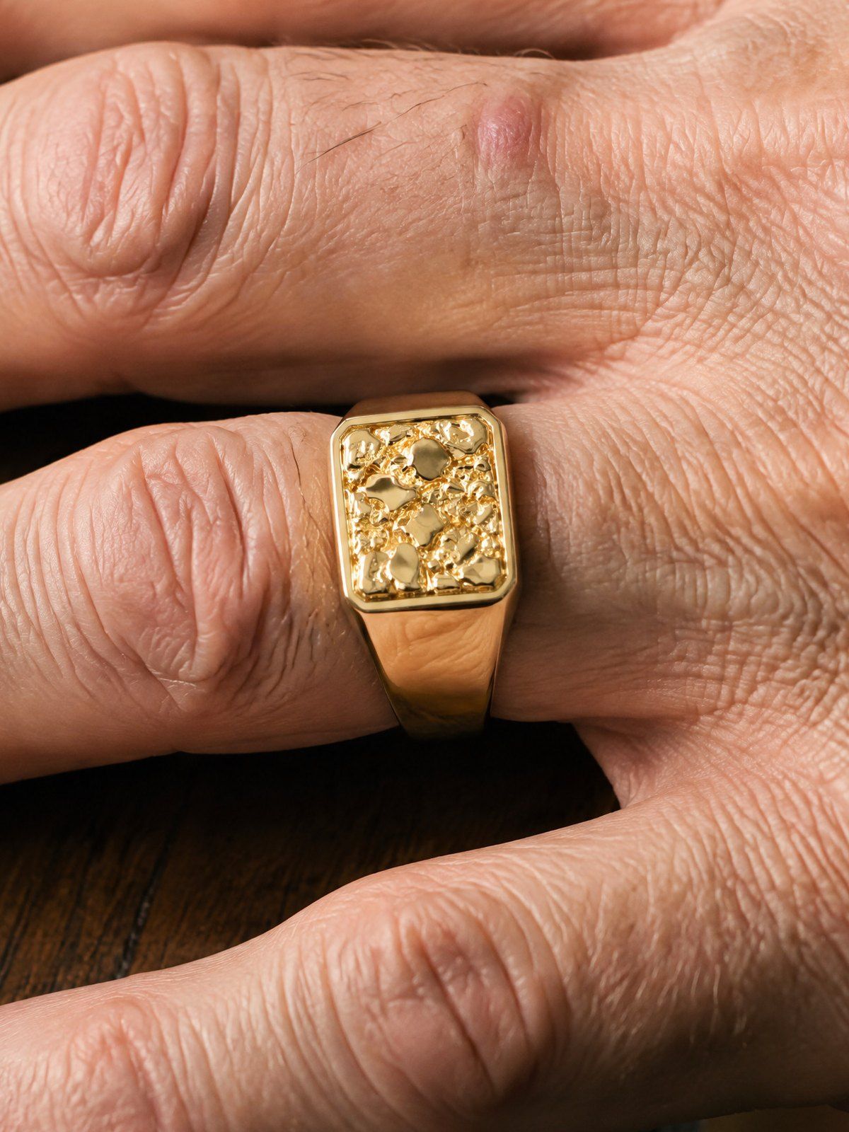 Anvil No. 501 in solid 14K gold, worn on another hand