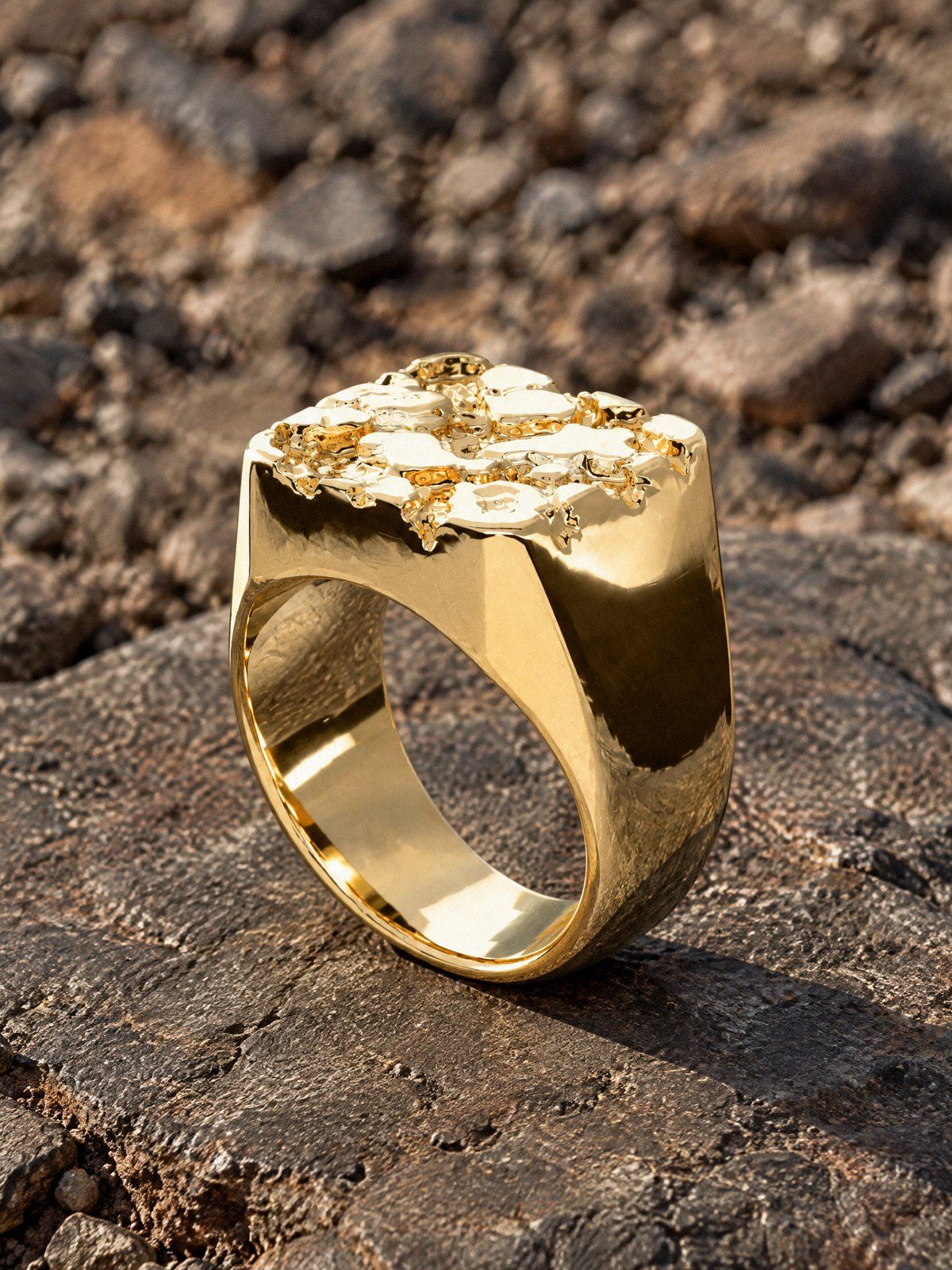 Bullion No. 502 in solid 14K gold, still life on dark stone