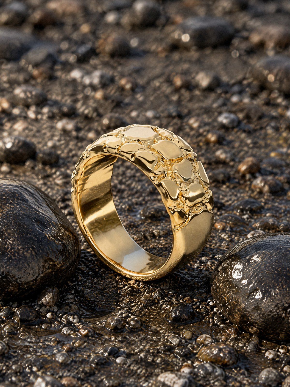 Riverbed No. 507 in solid 14K gold, still life on river stones