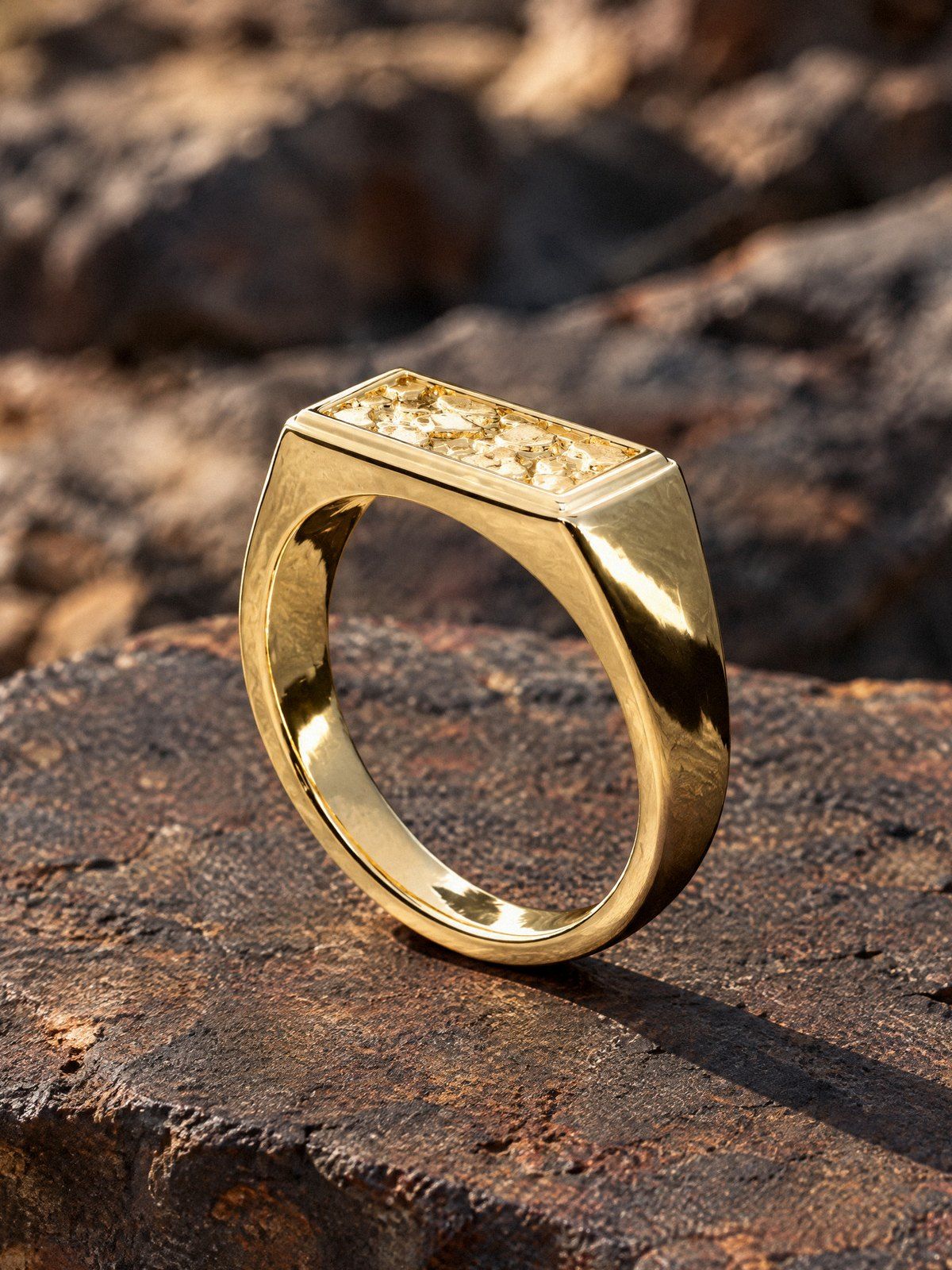 Ingot No. 533 in solid 14K gold, still life on dark stone